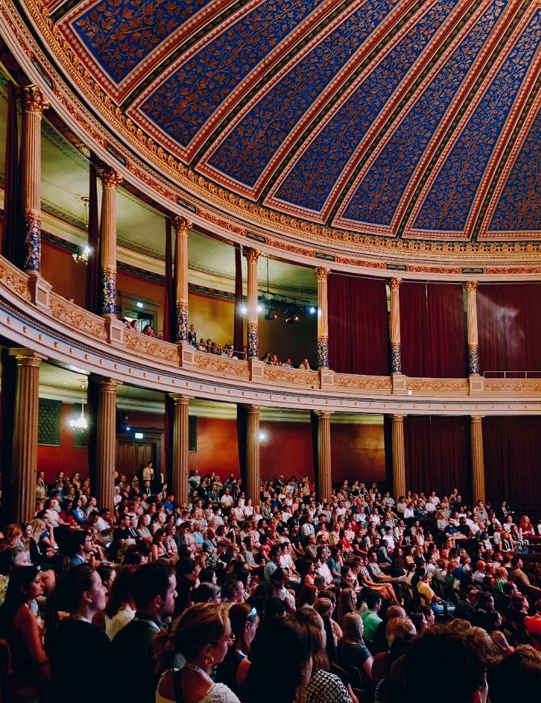 Grand auditorium with a painted dome during a keynote at ISBNPA 2023 in Uppsala